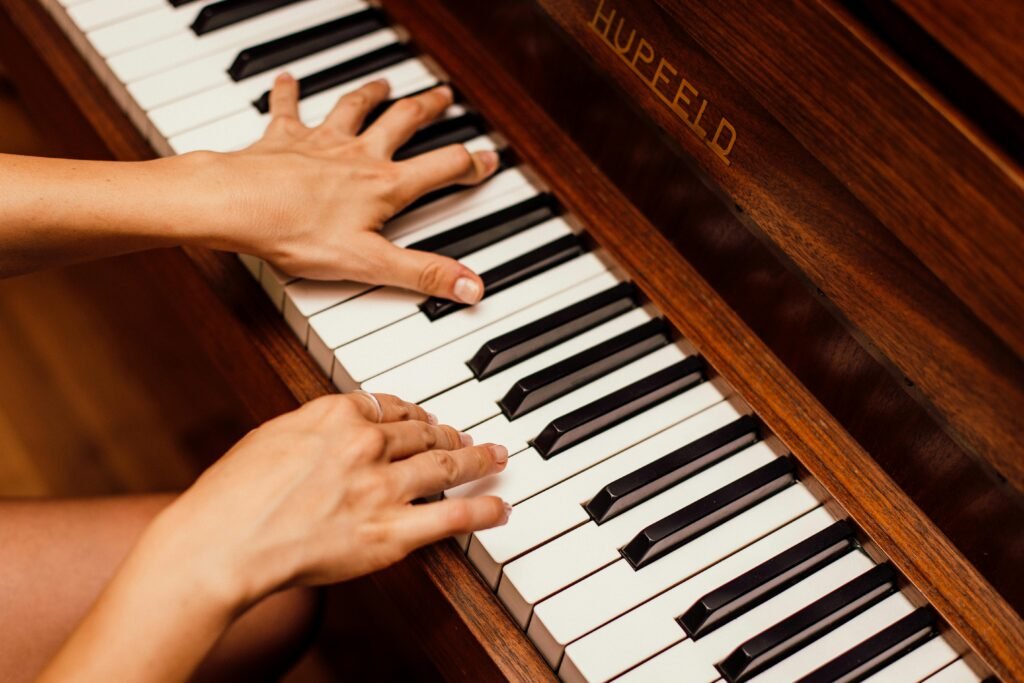 pexels-photo-1246437-1246437 female hands playing the piano at piano lessons in Huntsville