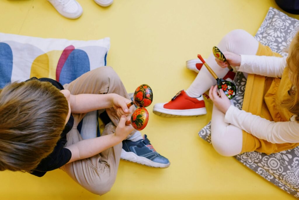 Kids engaging with maracas as part of movement in piano lessons for fun, hands-on learning